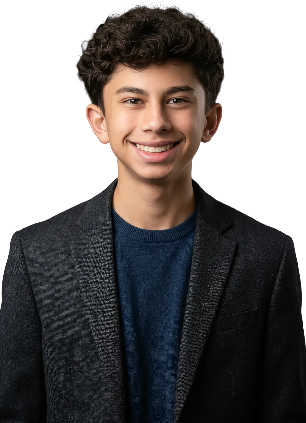 Orion smiling, in a charcoal blazer over a navy sweater.